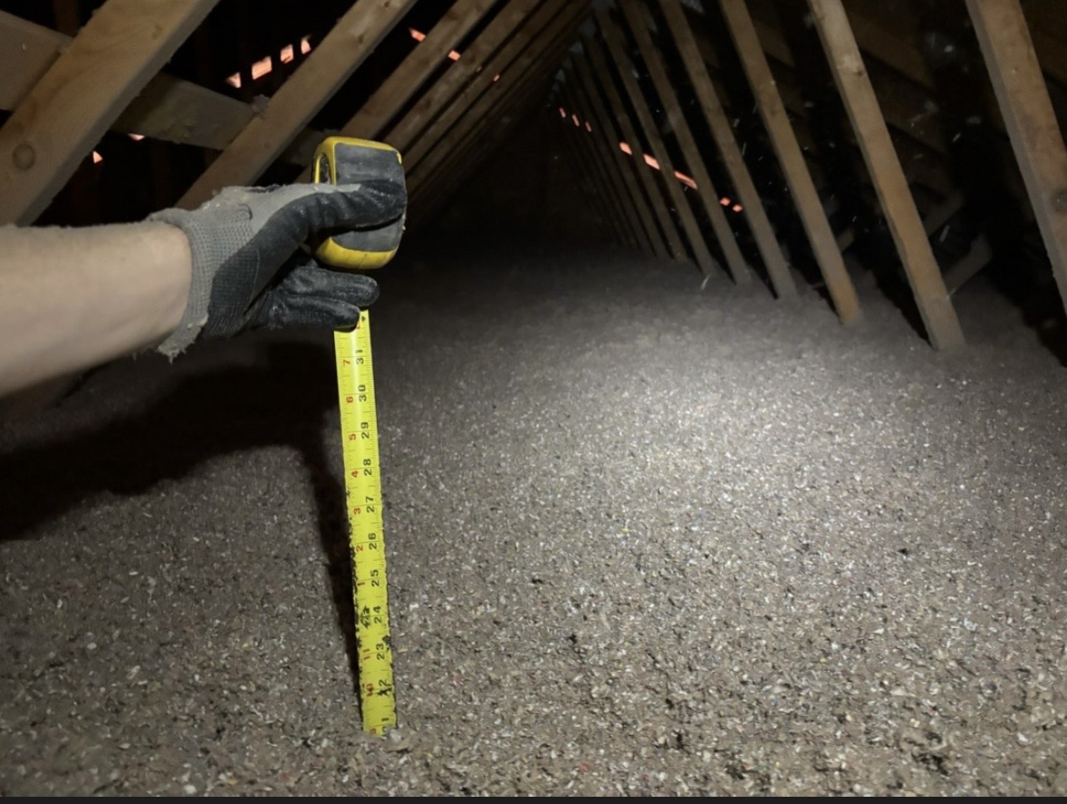 Showing depth of attic insulation