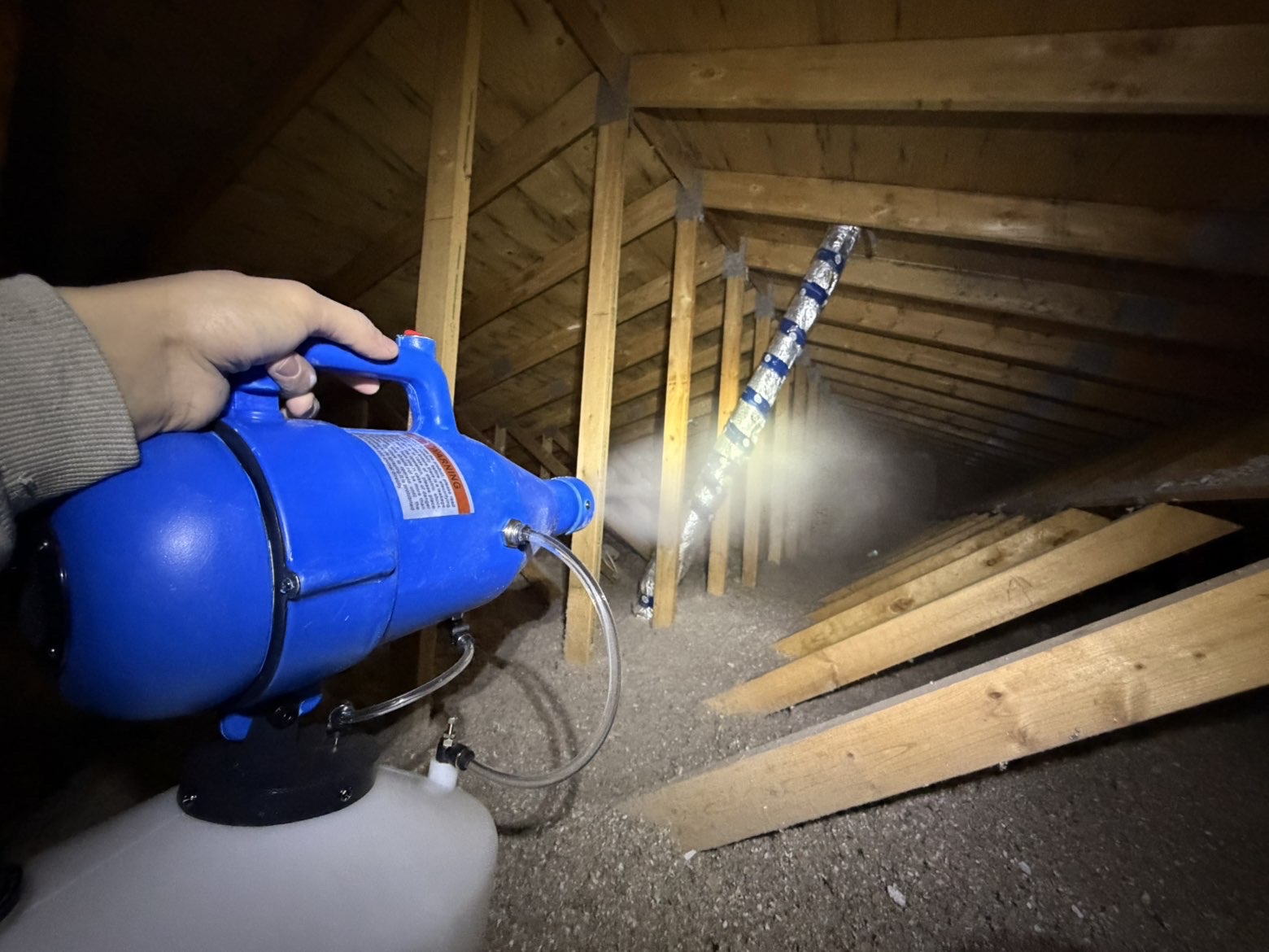 Blowing in insulation to attic space